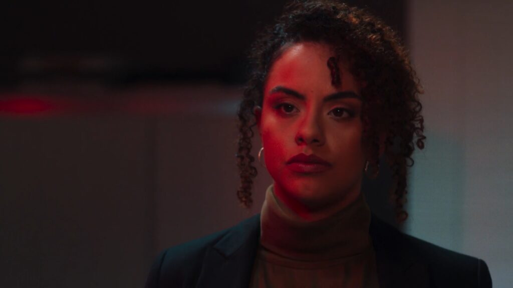 Close up of a woman washed in red light