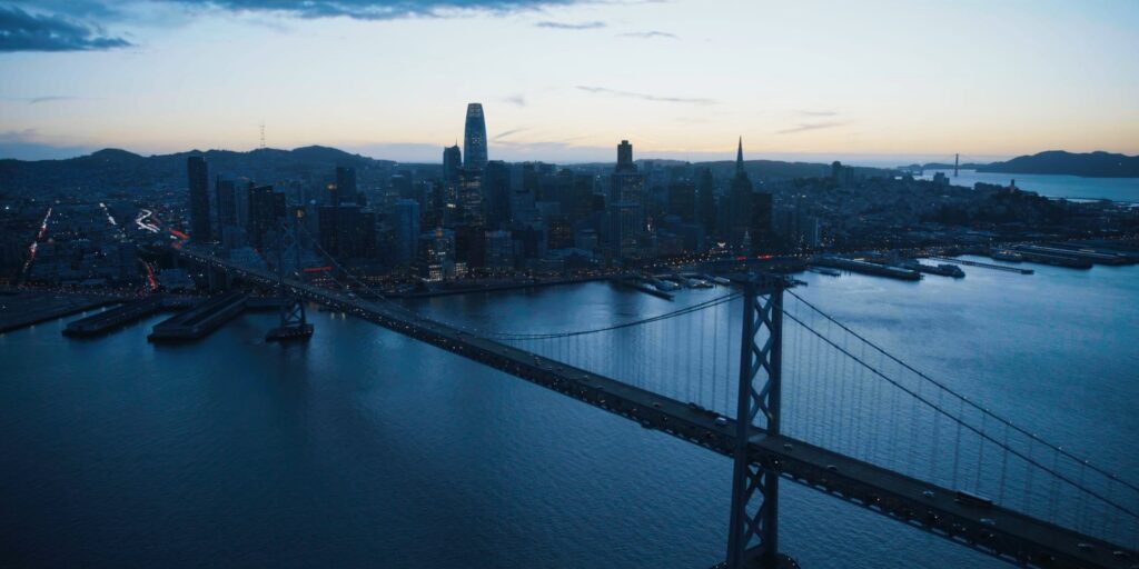 Night areal shot of San Francisco and bay bridge