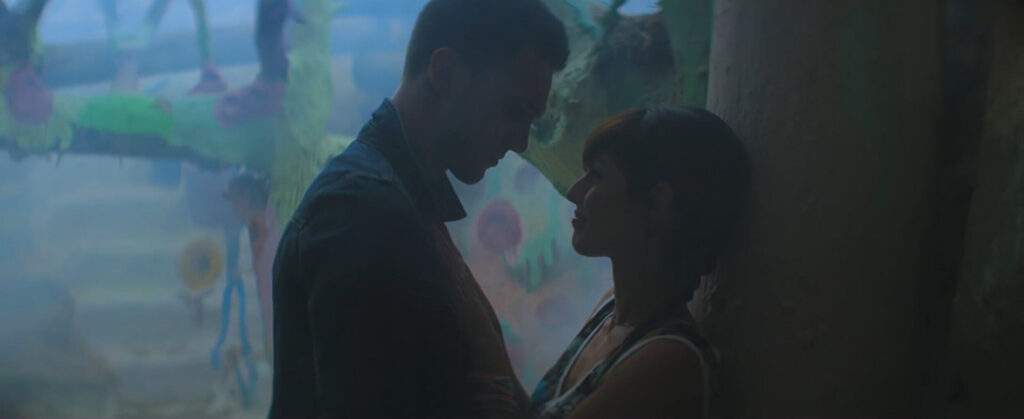 Close up of a man and woman looking at each other in silhouette lighting and in profile