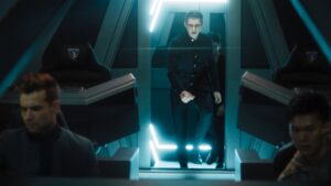 Actor Ben Radcliffe in Pandora series walking in sci-fi lit corridor