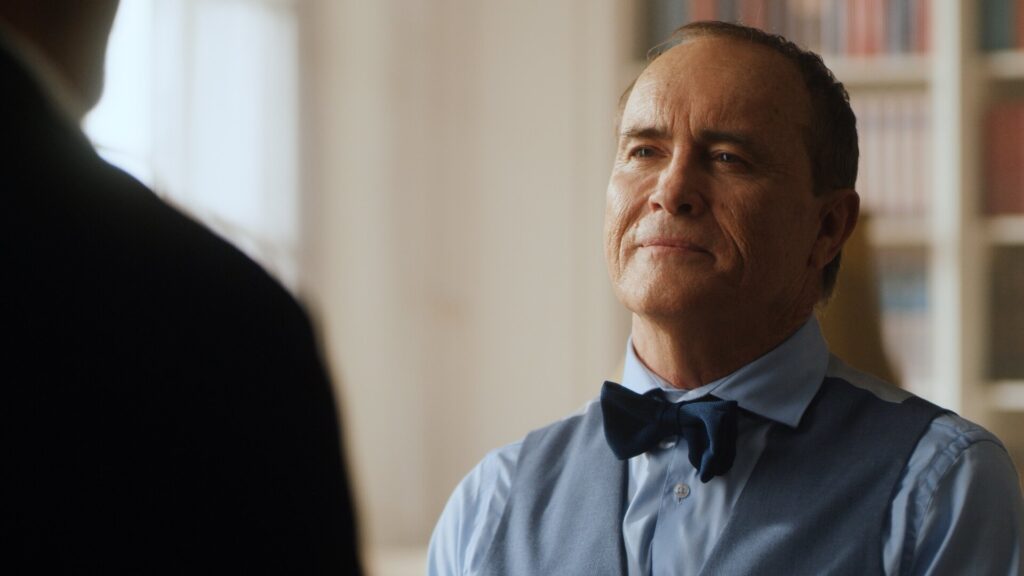 Close up of Jeffrey Combs in living room set of Pandora TV series