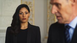 Tehmina Sunny looking at actor Ben Cross