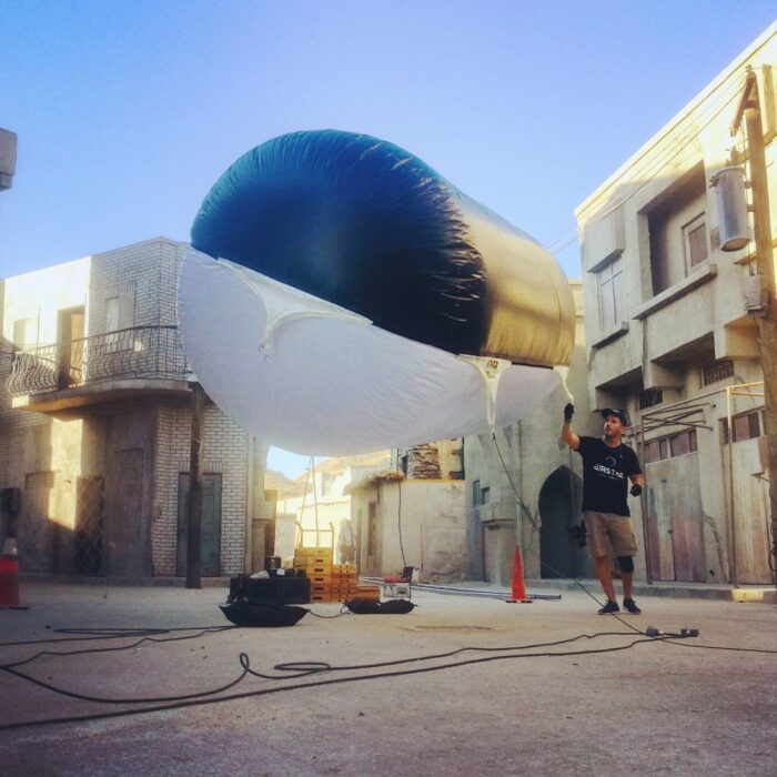 balloon light set up with one tech holding it in place