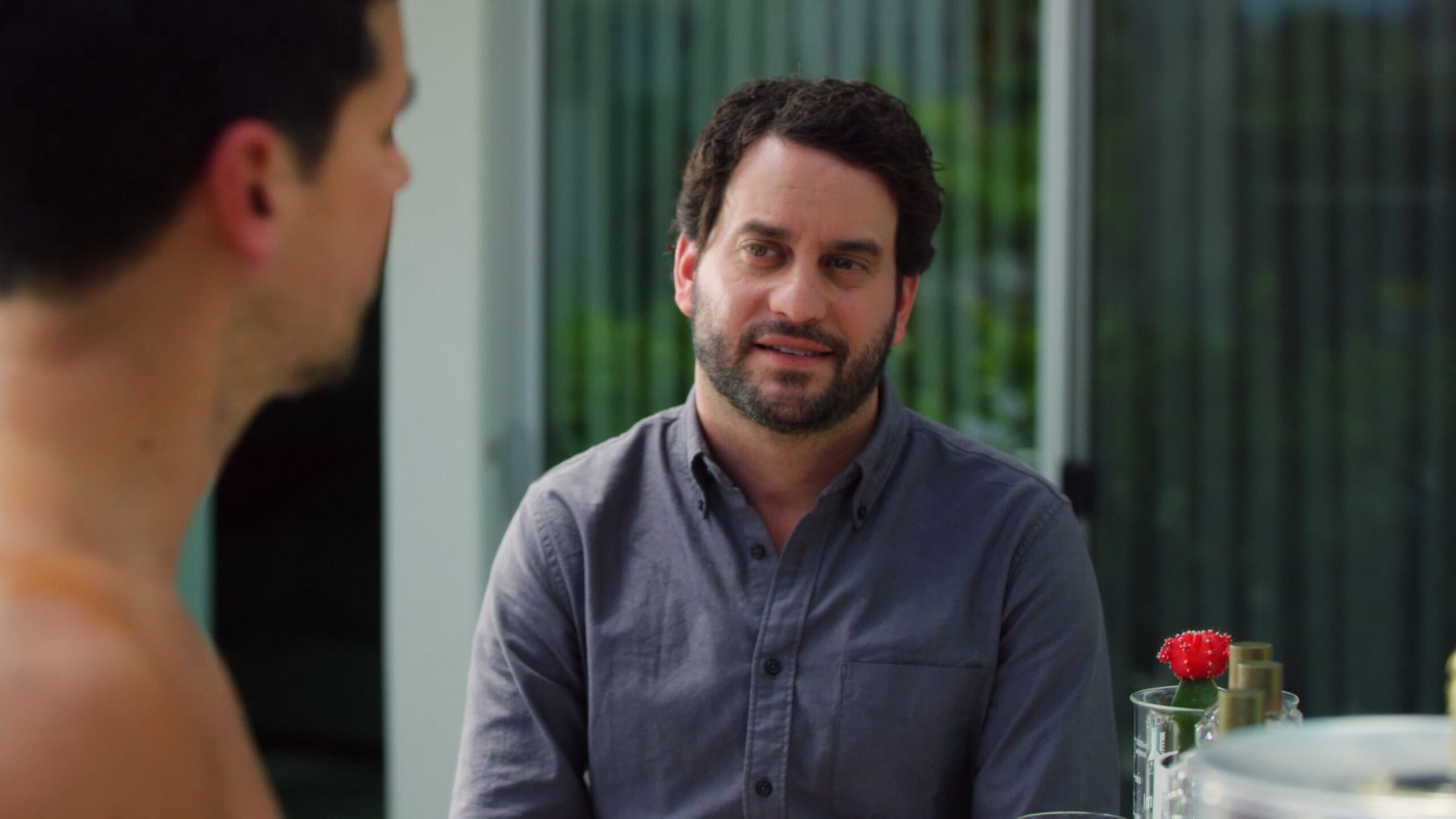 two men talking to each other outside