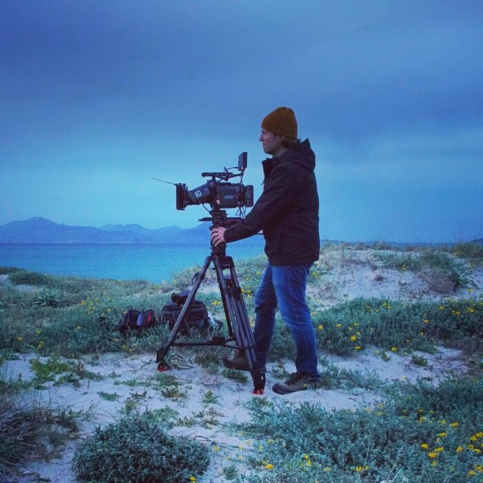 Maximilian Schmige with Arri Alexa mini camera on beach