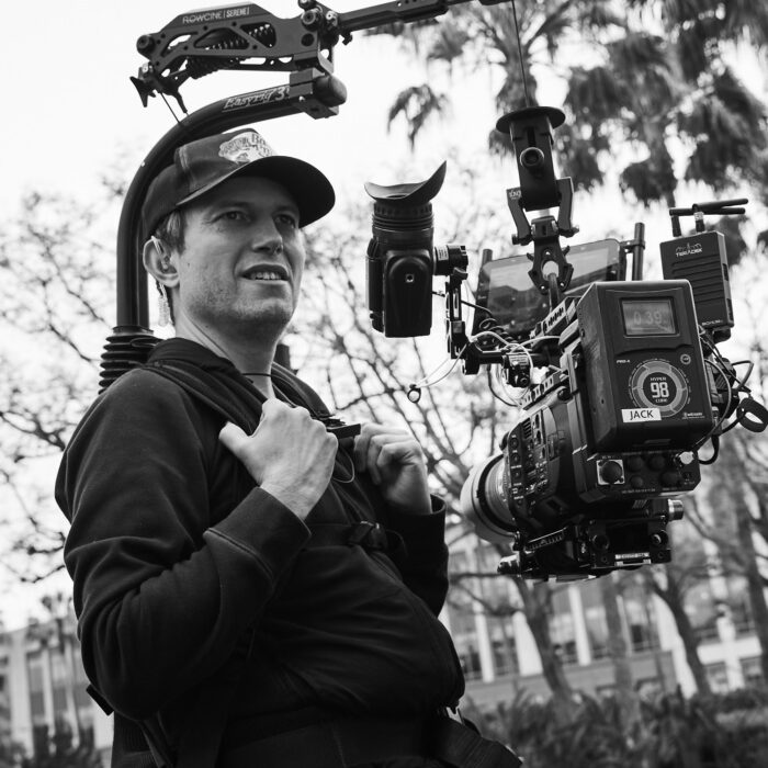 Director of Photography Maximilian Schmige holding Sony FS7 camera and EasyRig with flowcine serene arm