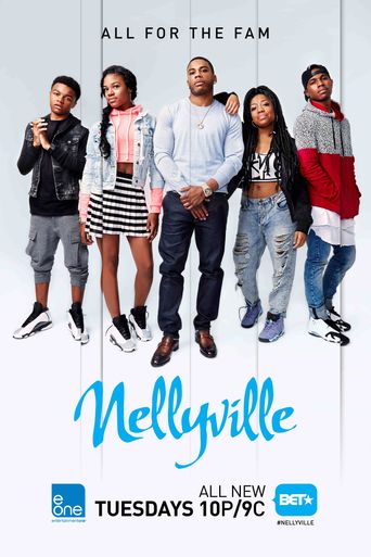 Groupd photo of rapper Nelly and his children next to him. Image redirects to website.
