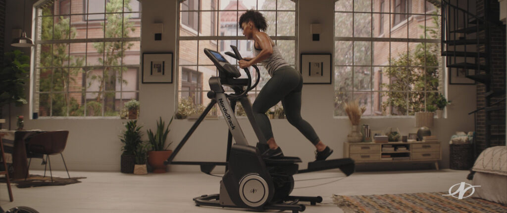 Woman exercising on a treadmill in a New York Brooklyn apartment