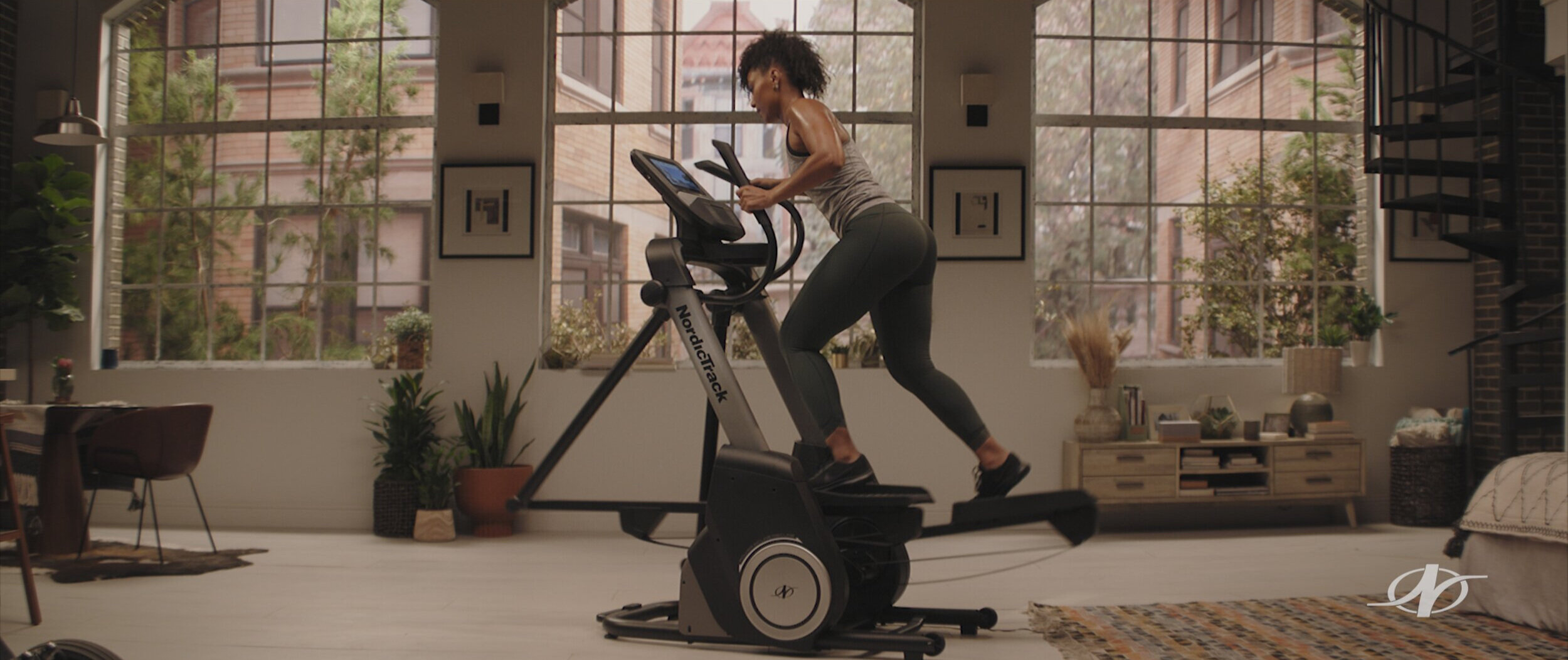 Woman exercising on a treadmill in a New York Brooklyn apartment