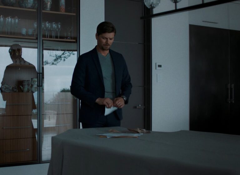 Amadeus Serafini wriping a letter at a table