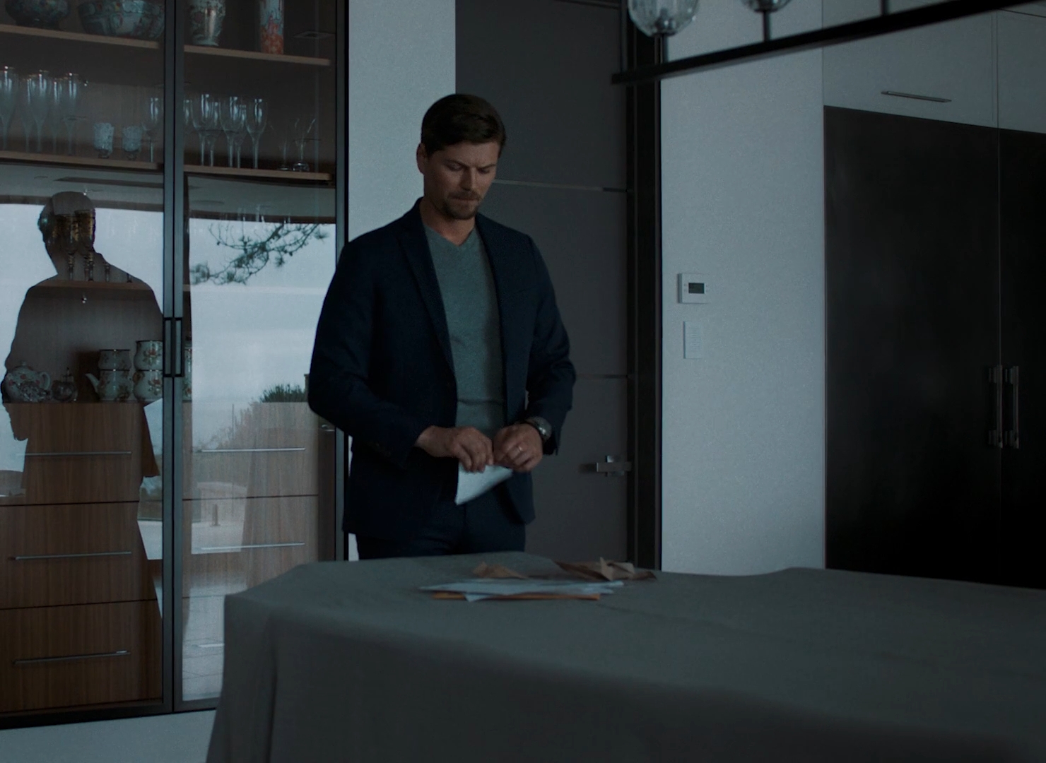 Amadeus Serafini wriping a letter at a table