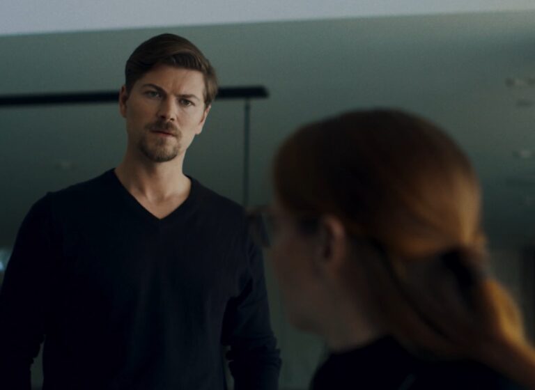 Amadeus Serafini looking intensely at Cary Cox