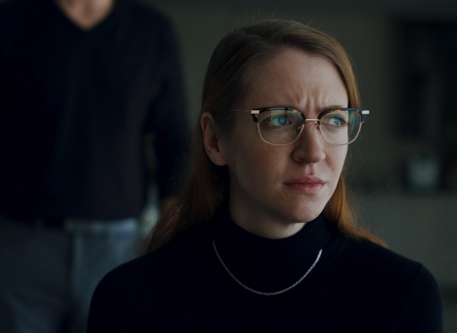 Carey Cox close up looking out a window