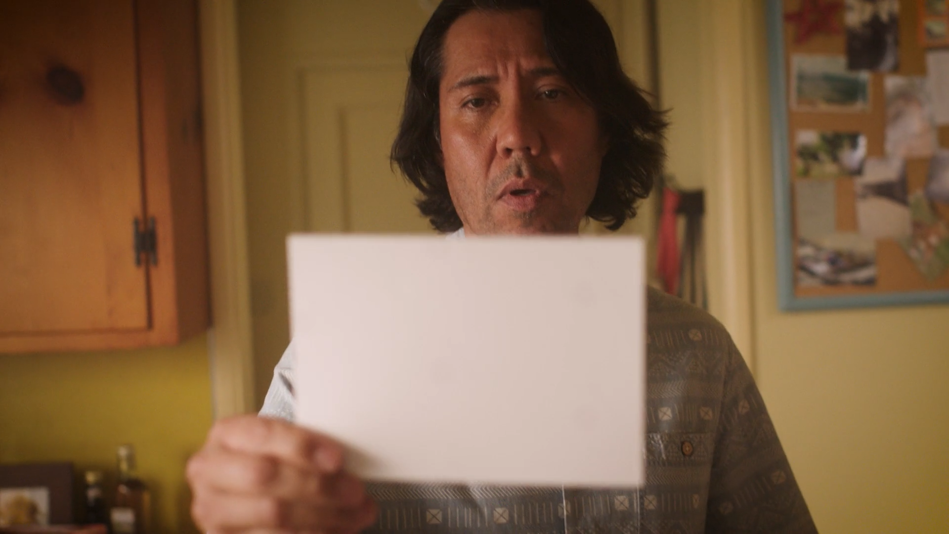 Man looking at a photo