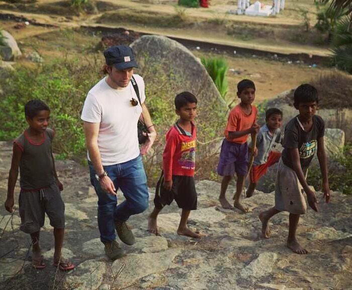Cinematographer Maximilian Schmige walking with children in India