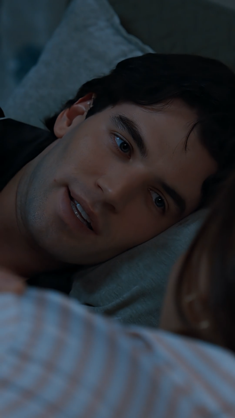 Close up of man lying in bed at night in moonlight