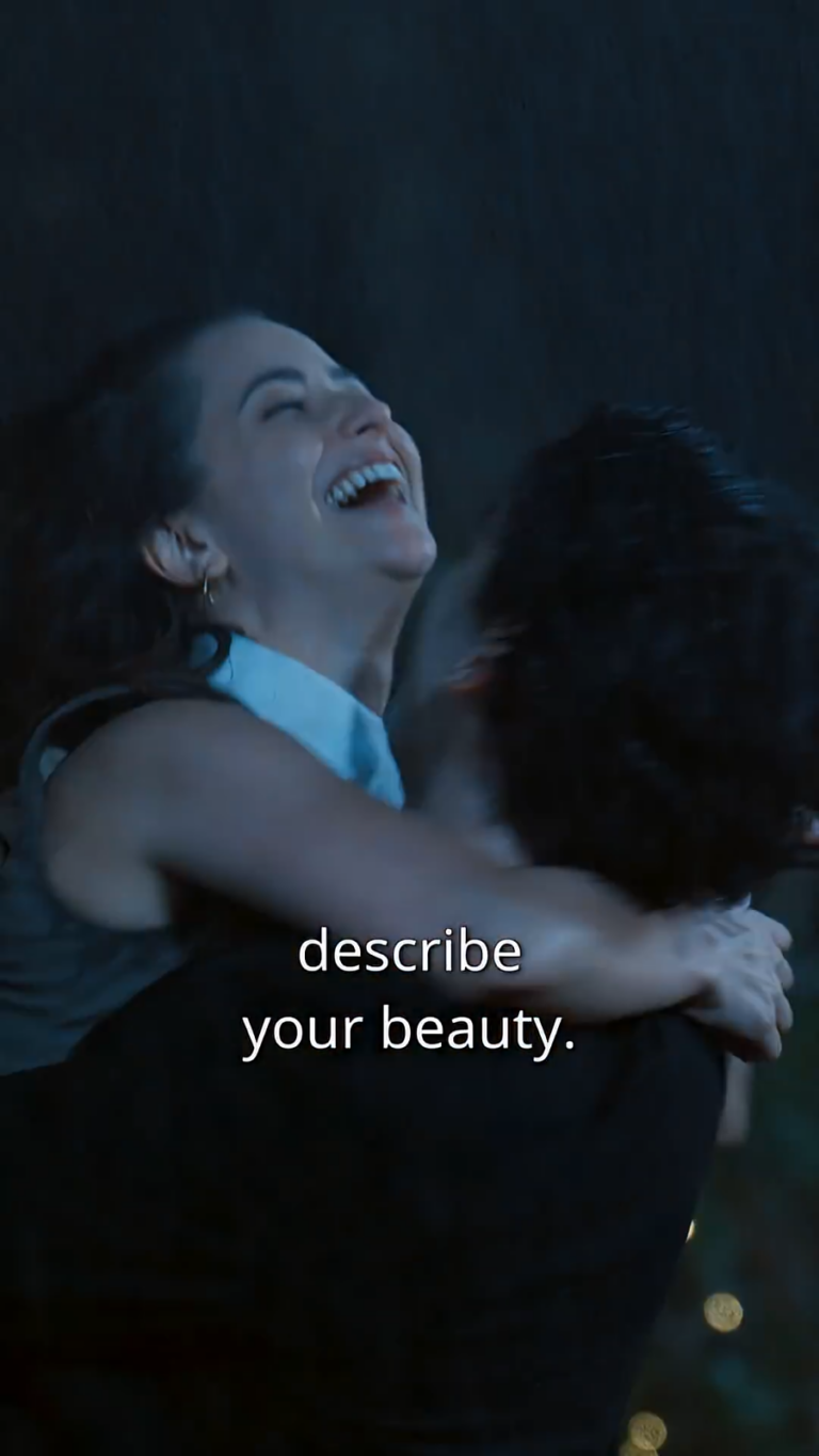 Close up of couple embracing in the rain in moonlight