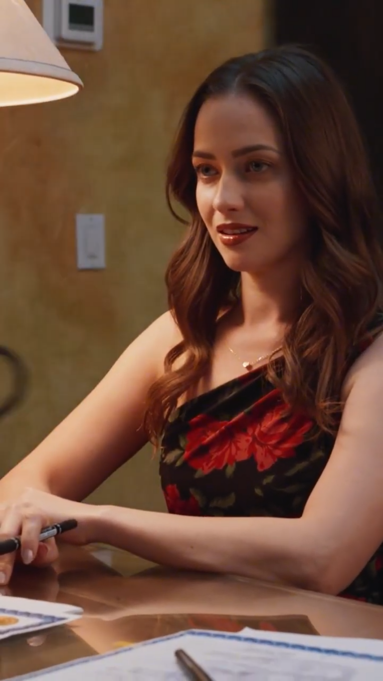 Close up of actress Chena Verony sitting at a desk