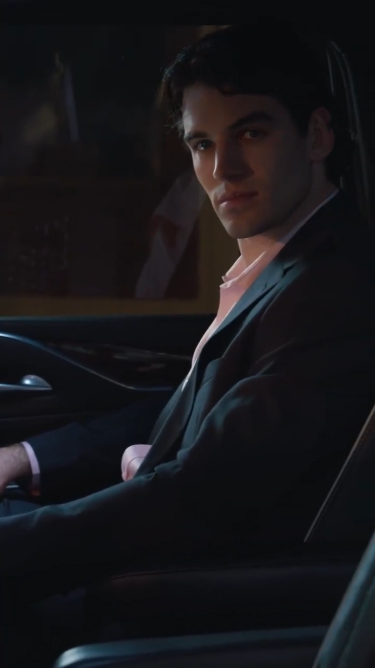 Actor Noah Huntley sitting in car at night looking towards camera