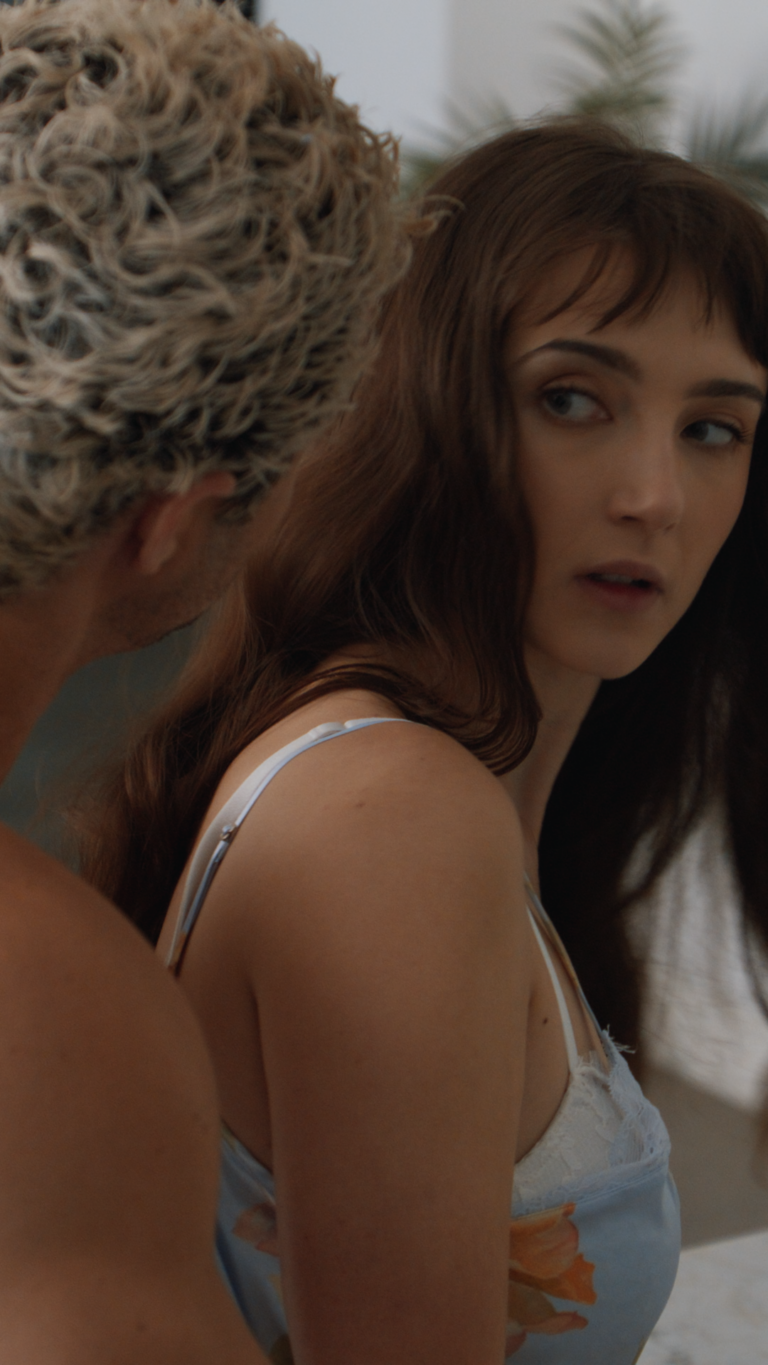 Tess Dinerstein looking over her shoulder onto Jarod Staub