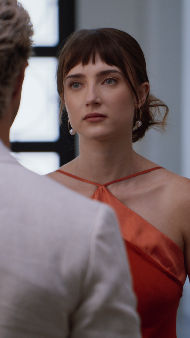 Over the shoulder shot on Tess Dinerstein in red dress